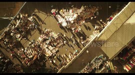 filming the relfection of the encants second hand market in barcelona from the mirrored roof