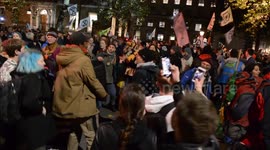Extinction Rebellion protesters dance at Whitehall as police order they move to Trafalgar Square