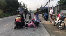 Motorcycle rider knocked out by stray dog running across road in Thailand