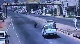 Ghost rider! Motorbike rolls for 400-metres after driver was knocked off in Thailand