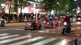Super Mario karts driving around Tokyo