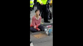 Extinction Rebellion protester tries to glue herself to Whitehall Road