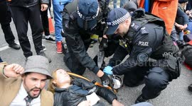 Extinction Rebellion protesters glue themselves to road outside London City Airport