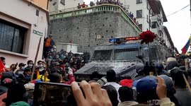 Ecuadorian protesters block riot police truck