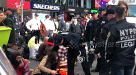 New York climate protesters block Times Square and get arrested by NYPD