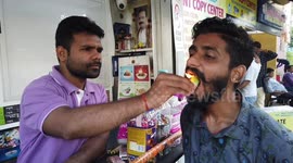 Man Eating Fire Paan in Southern India.