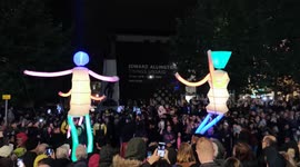 Giant puppets parade through the streets of Leeds.