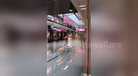 Police seen sprinting through Manchester's Arndale Centre during knife attack