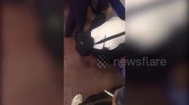Police rescue toddler who fell onto tracks at train station in China