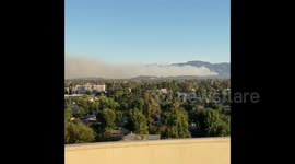 Southern California sees wall of smoke from brush fires that claimed one life and many homes