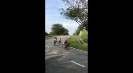 Delivery rider races boys on push bikes