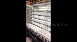 Empty supermarket shelves in Yokohama as Japan braces for powerful storm