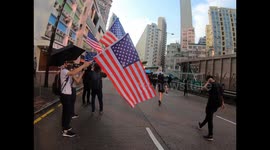 Protesters march with the US flag in Hong Kong as illegal marches show no signs of abating