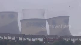 Cool slow motion video captures cooling towers demolished by controlled explosives