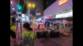 Hong Kong riot police clear barricade as tensions remain high in another weekend of protests