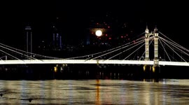 October's Hunter's full moon rises behind the beautiful Albert Bridge in South West London