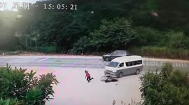 Chinese motorcyclist lands on his feet after collision with minibus and runs away