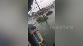 Vehicles drive through flooded streets as Typhoon Hagibis in Japan