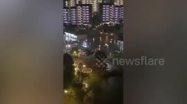 Man seen on swing in Tokyo as Typhoon Hagibis hits Japan