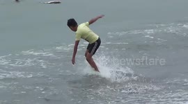 Children Enjoy Surfing with Broken Boards