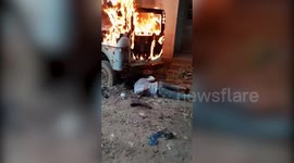 Locals crawl under burning car to rescue trapped puppies in west India