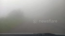 Low visibility creates hazardous driving conditions in Indonesia's winding roads