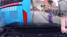 Motorist in China screams in terror as bus with no driver slides into his car