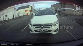 Idiot motorist falls off motorbike without any protective gear after attempting a wheelie