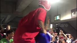 Fans celebrate Japan's historic victory over Scotland at Yokohama stadium