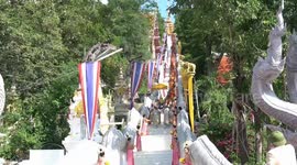 Devotees recreate Buddha descending steps from heaven to mark the end of lent period