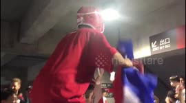 Fans celebrate Japan's victory over Scotland at Yokohama stadium