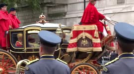 The royal regalia carriages return from the State Opening of Parliament via Horse Guards in Whitehall