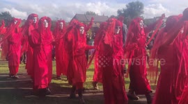 Further footage of performance artists walking through Vauxhall park