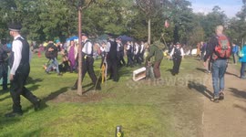 Police officers converge on Extinction Rebellion protesters in Vauxhall Park