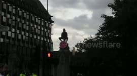 Extinction Rebellion protester climbs Palace of Westminster gates
