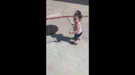 Curious toddler in California is afraid of her own shadow
