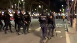 Spanish police attempt to disperse rioting crowds in Barcelona