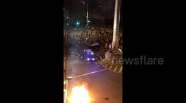 Demonstrators nearly run over by Barcelona police vans during clashes