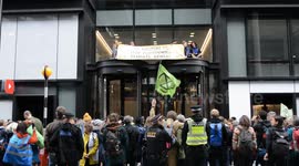 Extinction Rebellion protesters climb on YouTube's London HQ