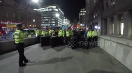 Extinction Rebellion Protestors Are Escorted By Police Over London Bridge