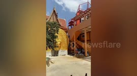 Dramatic moment 16ft-high 'lucky' Buddha statue drops from crane and smashes into the ground