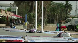 people selling sarongs on the beach, barcelona
