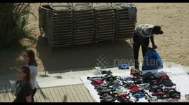 people selling sarongs on the beach, barcelona