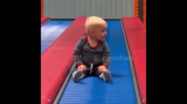 Baby boy has 'jumping feet' while going down bumpy slide
