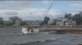 Sailboat blown ashore by bomb cyclone in US Northeast