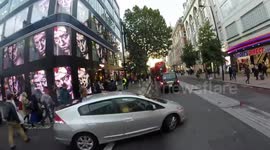 Driver pulls out in front of cyclist on London's Oxford Street