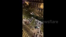 Catalan protestors throw chairs and glasses at riot police truck in running street battles