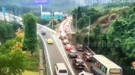 Vehicles narrowly avoid being buried by mud and trees after landslide in Chongqing