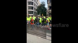 General strike begins as workers march through the centre of Barcelona