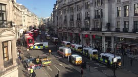 Large police presence as Extinction Rebellion block Oxford Circus with massive wooden structures